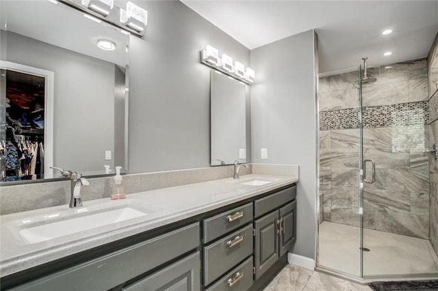 24208 E Orient Cemetery Rd, Harrisonville, MO 64701 - full bath featuring double vanity, a shower stall, marble finish floors, recessed lighting, and a walk in closet