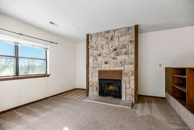 1339 Westbrooke St, Lawrence, KS 66049 - unfurnished living room featuring a textured ceiling, a stone fireplace, carpet floors, and baseboards