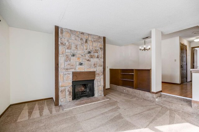 1339 Westbrooke St, Lawrence, KS 66049 - unfurnished living room with carpet floors, a fireplace, baseboards, a chandelier, and a textured ceiling