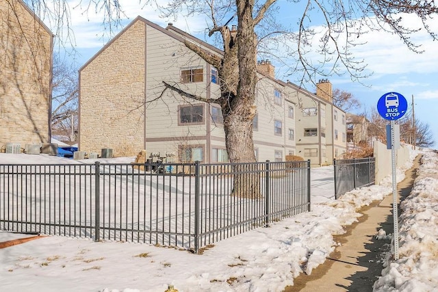 1339 Westbrooke St, Lawrence, KS 66049 - view of snowy exterior with stone siding