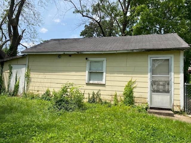 1209 S 6th St, Atchison, KS 66002 - view of side of property featuring a shingled roof