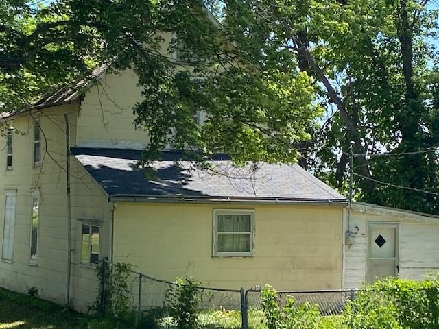 1209 S 6th St, Atchison, KS 66002 - view of home's exterior featuring roof with shingles