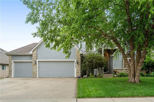 2705 W 137th Pl, Leawood, KS 66224 - view of property hidden behind natural elements featuring driveway, stone siding, a front lawn, and an attached garage