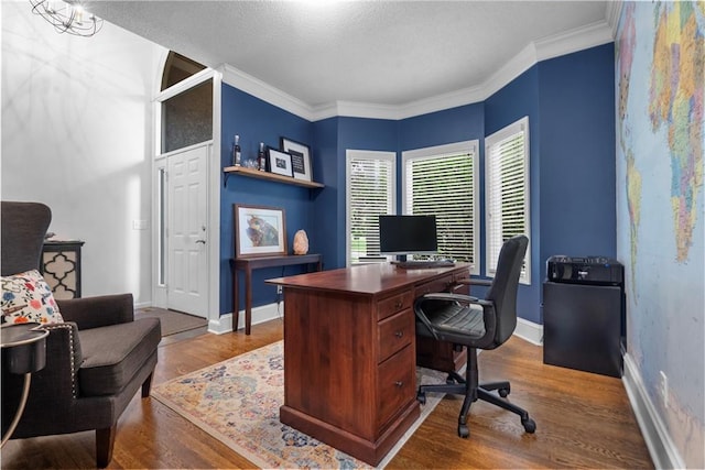 2705 W 137th Pl, Leawood, KS 66224 - office area featuring dark wood-style flooring, baseboards, ornamental molding, and a textured ceiling