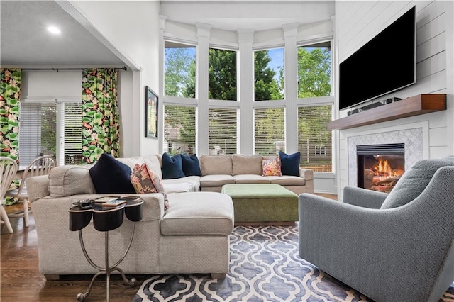 2705 W 137th Pl, Leawood, KS 66224 - living room with wood finished floors, a tiled fireplace, recessed lighting, and a high ceiling