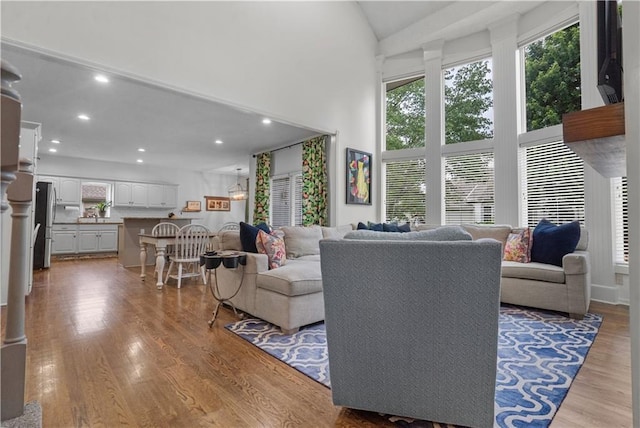 2705 W 137th Pl, Leawood, KS 66224 - living room with light wood-style floors, recessed lighting, and high vaulted ceiling