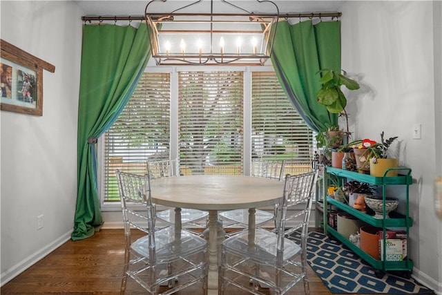 2705 W 137th Pl, Leawood, KS 66224 - dining area featuring a chandelier, baseboards, and wood finished floors
