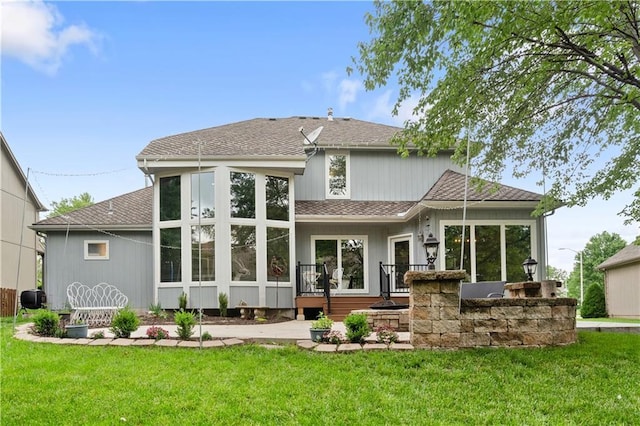 2705 W 137th Pl, Leawood, KS 66224 - back of house featuring a lawn and roof with shingles