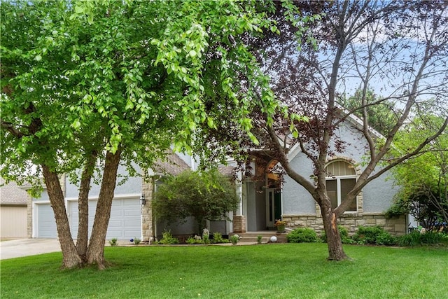 2705 W 137th Pl, Leawood, KS 66224 - view of property hidden behind natural elements with driveway, stone siding, a front yard, and a garage