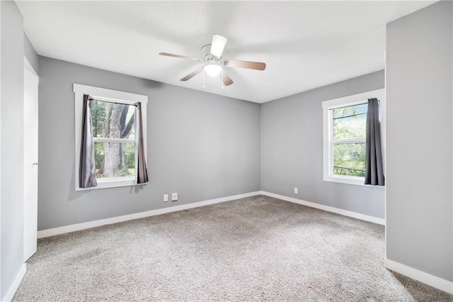 508 N Geronimo Dr, Independence, MO 64056 - carpeted empty room with baseboards and a ceiling fan