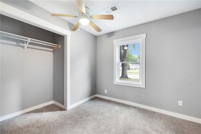 508 N Geronimo Dr, Independence, MO 64056 - unfurnished bedroom featuring carpet flooring, a closet, baseboards, and ceiling fan