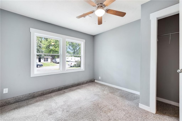 508 N Geronimo Dr, Independence, MO 64056 - unfurnished bedroom featuring carpet flooring, a closet, baseboards, and ceiling fan