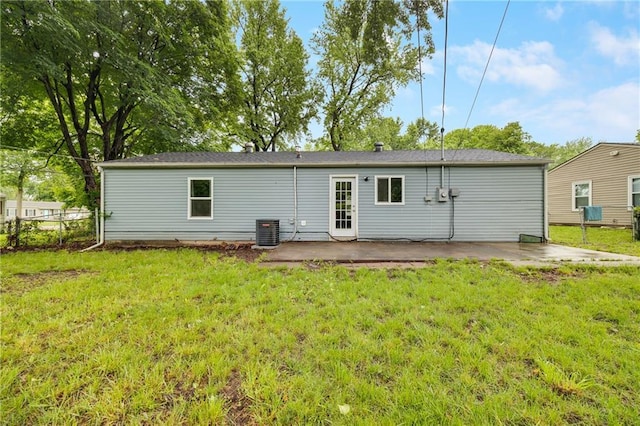 508 N Geronimo Dr, Independence, MO 64056 - back of property with a patio, a yard, and central AC