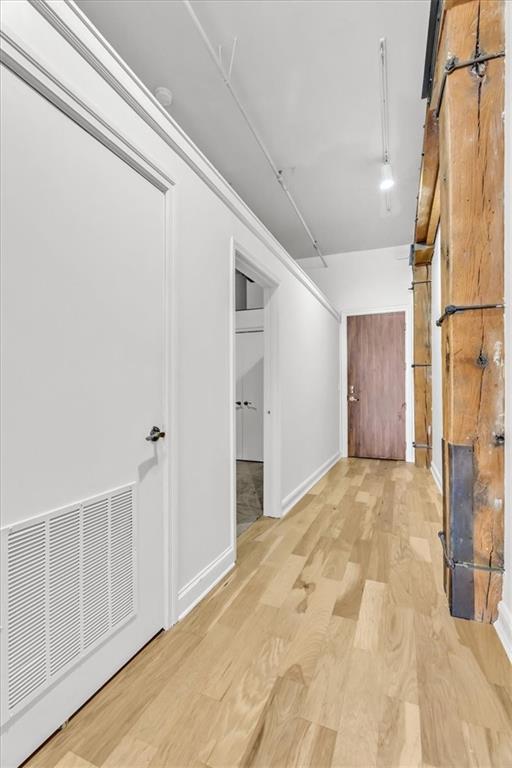 200 Main St Unit 211, Kansas City, MO 64105 - hallway with wood finished floors and baseboards