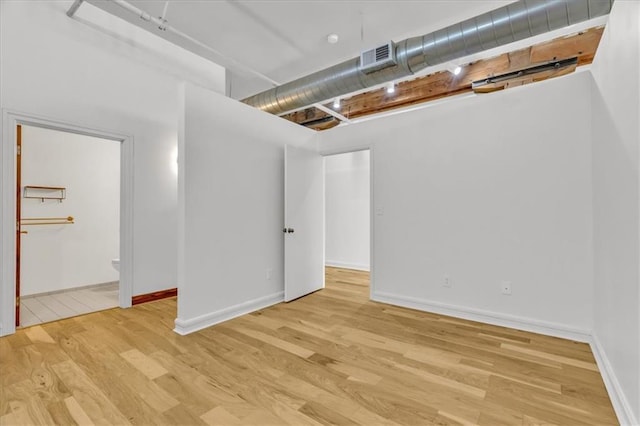 200 Main St Unit 211, Kansas City, MO 64105 - basement featuring wood finished floors and baseboards