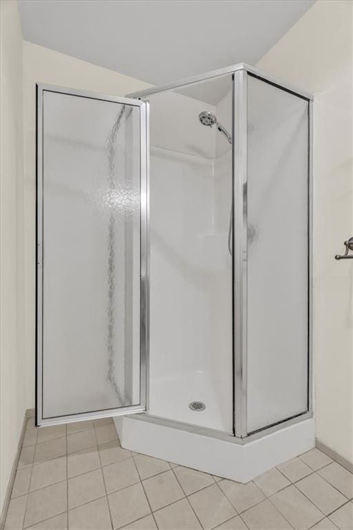 200 Main St Unit 211, Kansas City, MO 64105 - full bathroom with a stall shower and tile patterned flooring