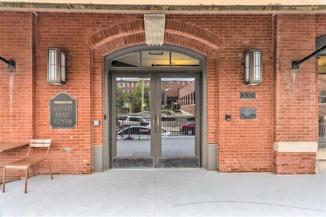 200 Main St Unit 211, Kansas City, MO 64105 - doorway to property featuring french doors and brick siding