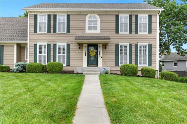 10500 Reeder St, Overland Park, KS 66214 - view of front of house featuring a front yard