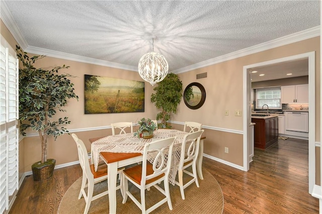 10500 Reeder St, Overland Park, KS 66214 - dining area featuring a textured ceiling, a chandelier, dark wood-type flooring, crown molding, and baseboards