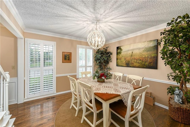 10500 Reeder St, Overland Park, KS 66214 - dining space featuring a chandelier, a textured ceiling, wood finished floors, ornamental molding, and stairs