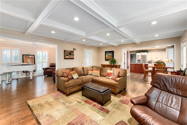 10500 Reeder St, Overland Park, KS 66214 - living room with coffered ceiling, light wood-style floors, beamed ceiling, recessed lighting, and ornamental molding