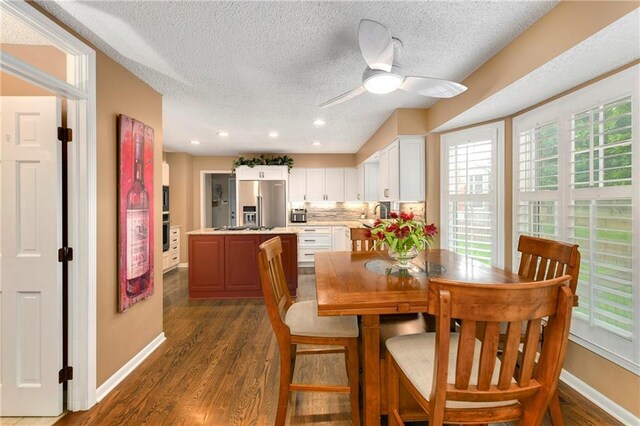 10500 Reeder St, Overland Park, KS 66214 - dining space featuring a textured ceiling, dark wood-type flooring, ceiling fan, baseboards, and recessed lighting