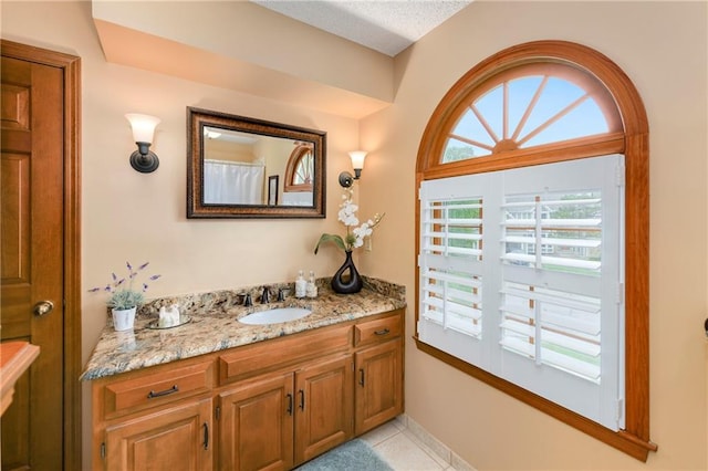 10500 Reeder St, Overland Park, KS 66214 - bathroom with vanity and tile patterned floors