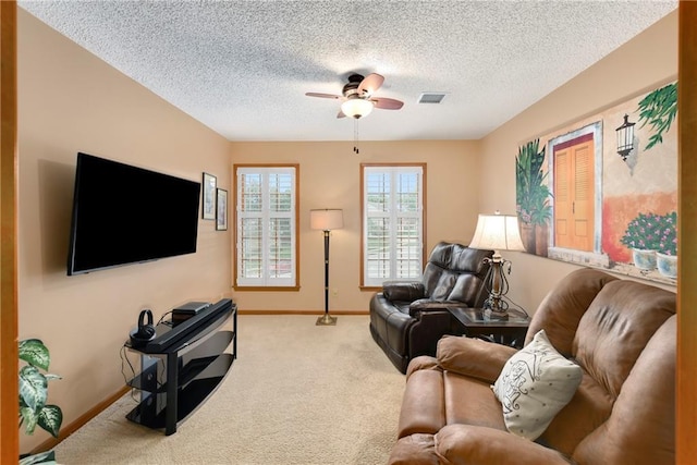 10500 Reeder St, Overland Park, KS 66214 - living room with a ceiling fan, carpet flooring, baseboards, and a textured ceiling