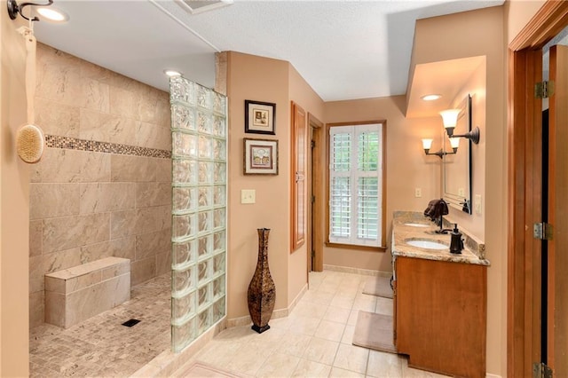 10500 Reeder St, Overland Park, KS 66214 - full bathroom with walk in shower, double vanity, tile patterned floors, and baseboards