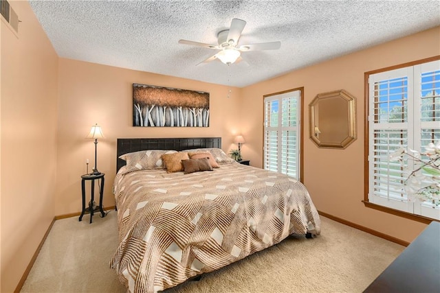 10500 Reeder St, Overland Park, KS 66214 - bedroom with light colored carpet, baseboards, a textured ceiling, and ceiling fan