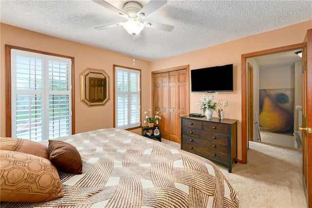 10500 Reeder St, Overland Park, KS 66214 - bedroom with light colored carpet, a closet, a textured ceiling, and a ceiling fan