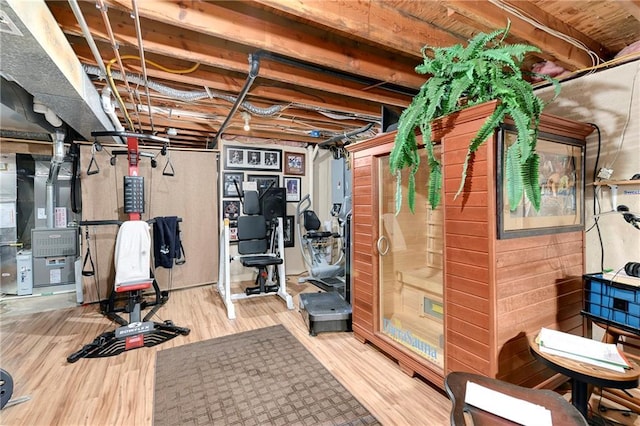 10500 Reeder St, Overland Park, KS 66214 - exercise room featuring wood finished floors and heating unit
