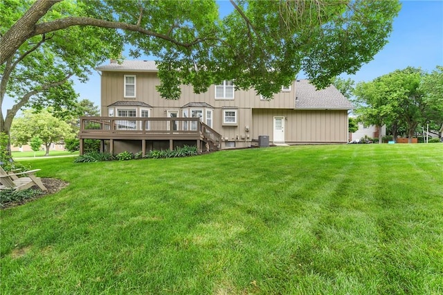 10500 Reeder St, Overland Park, KS 66214 - back of house featuring a deck, a lawn, central AC, and a shingled roof