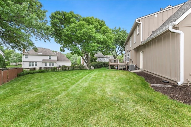 10500 Reeder St, Overland Park, KS 66214 - view of yard with a wooden deck and central AC unit
