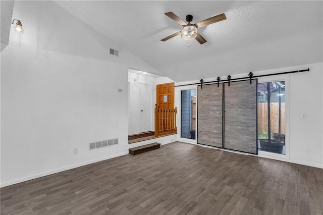 1528 E 123rd St, Olathe, KS 66061 - unfurnished living room featuring vaulted ceiling, a ceiling fan, wood finished floors, baseboards, and a textured ceiling