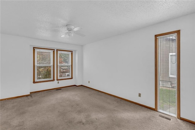 1528 E 123rd St, Olathe, KS 66061 - carpeted empty room with ceiling fan, a textured ceiling, and baseboards