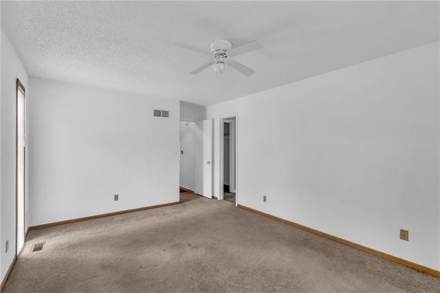 1528 E 123rd St, Olathe, KS 66061 - empty room featuring ceiling fan, carpet, and baseboards