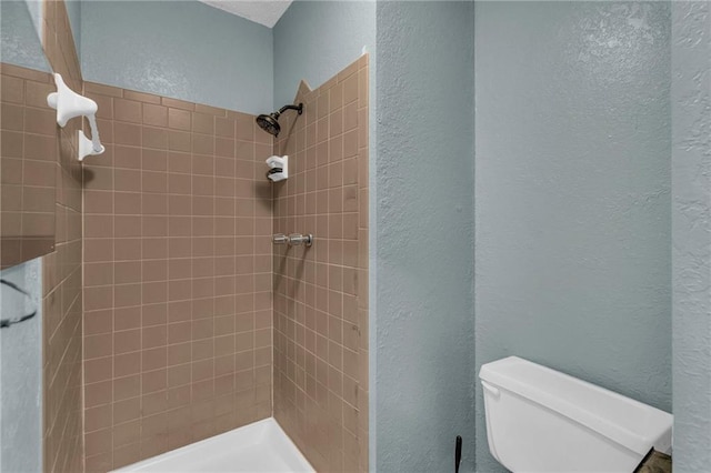 1528 E 123rd St, Olathe, KS 66061 - full bath with a textured wall, a tile shower, and toilet