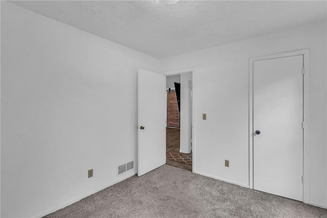 1528 E 123rd St, Olathe, KS 66061 - unfurnished bedroom featuring carpet flooring, a textured ceiling, and baseboards