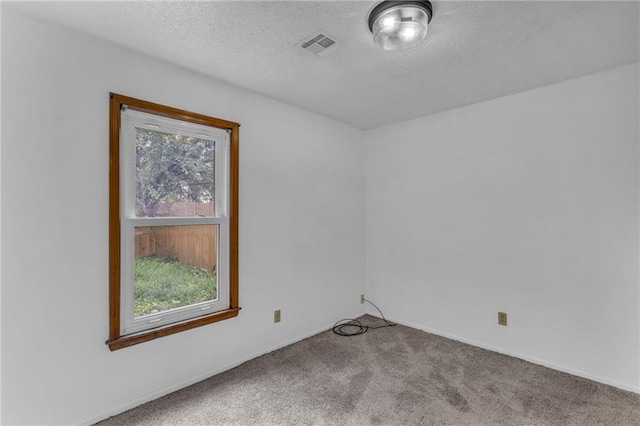 1528 E 123rd St, Olathe, KS 66061 - carpeted spare room with healthy amount of natural light, a textured ceiling, and baseboards