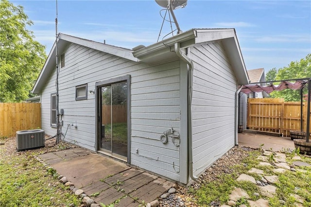 1528 E 123rd St, Olathe, KS 66061 - rear view of house with central AC and a patio