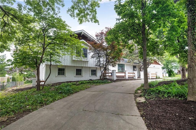 10416 Mohawk Ln, Leawood, KS 66206 - view of front of house with brick siding and concrete driveway
