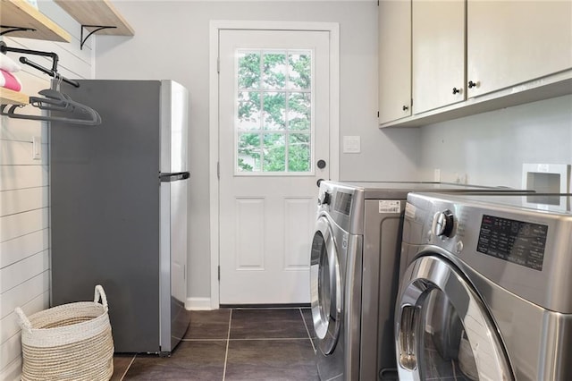 10416 Mohawk Ln, Leawood, KS 66206 - laundry area with cabinet space, washer and dryer, and dark tile patterned flooring
