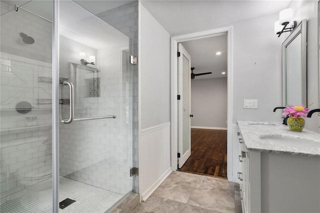 10416 Mohawk Ln, Leawood, KS 66206 - full bathroom with double vanity, a shower stall, and recessed lighting
