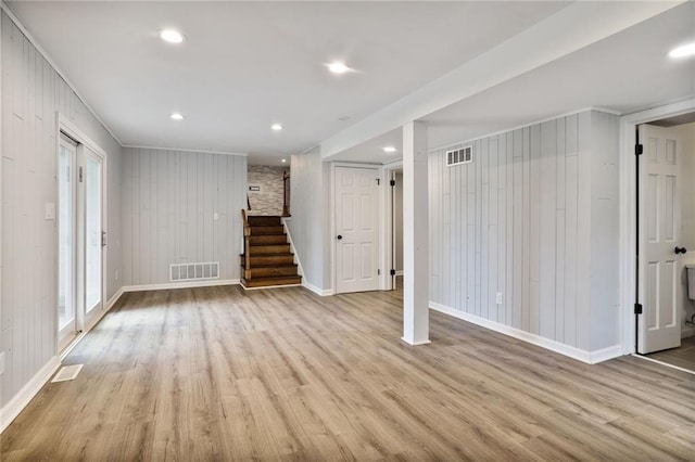 10416 Mohawk Ln, Leawood, KS 66206 - basement featuring stairway, wood finished floors, baseboards, recessed lighting, and wood walls