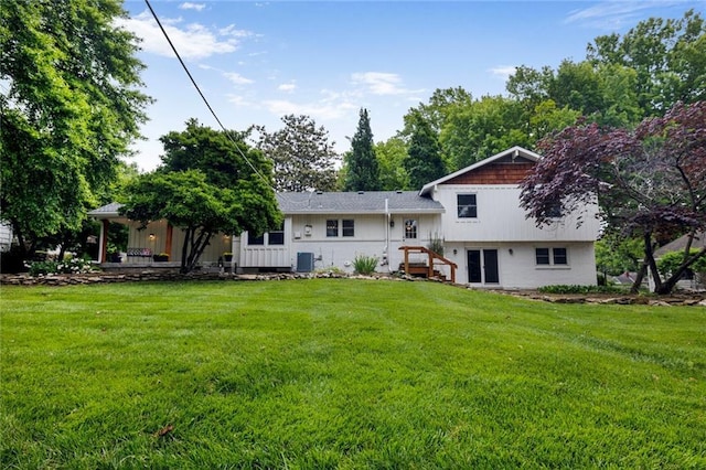 10416 Mohawk Ln, Leawood, KS 66206 - back of house with a yard and central air condition unit