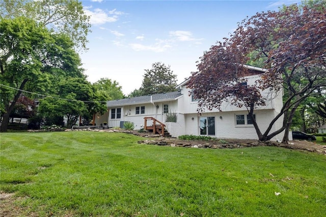 10416 Mohawk Ln, Leawood, KS 66206 - rear view of house featuring a yard and brick siding