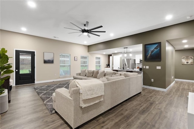 131 Cedar Ct, Warrensburg, MO 64093 - living area featuring wood finished floors, baseboards, ceiling fan, and recessed lighting