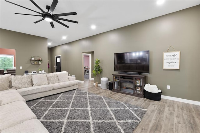 131 Cedar Ct, Warrensburg, MO 64093 - living area with wood finished floors, ceiling fan, recessed lighting, and baseboards