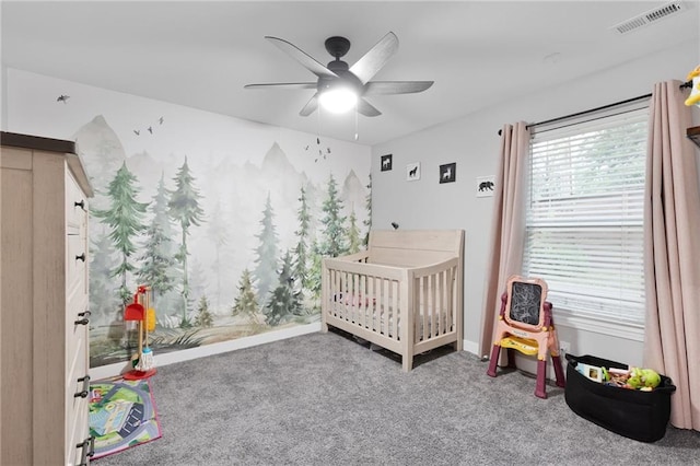 131 Cedar Ct, Warrensburg, MO 64093 - carpeted bedroom with a nursery area, a ceiling fan, and baseboards